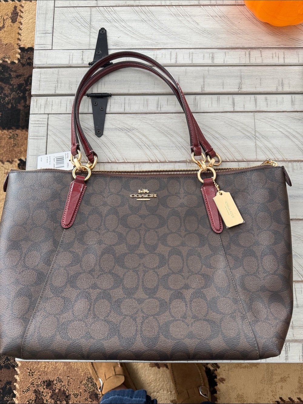 Coach Brown Signature Tote with Burgundy Handles